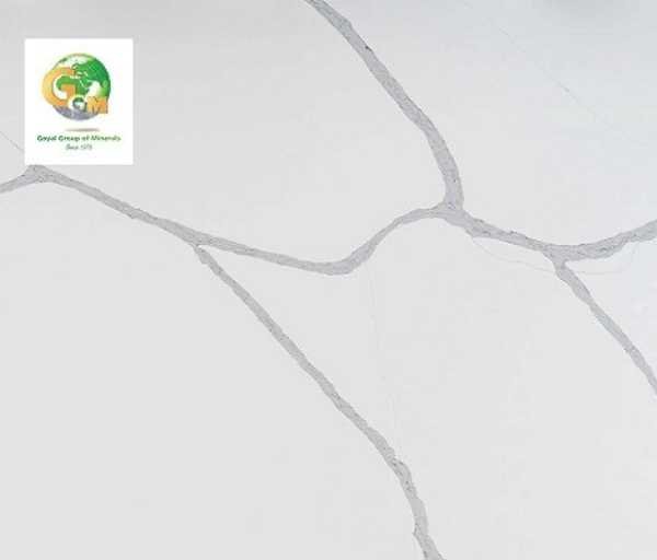 Calacatta Luna: Elegant white marble with soft grey veins, perfect for luxurious interiors